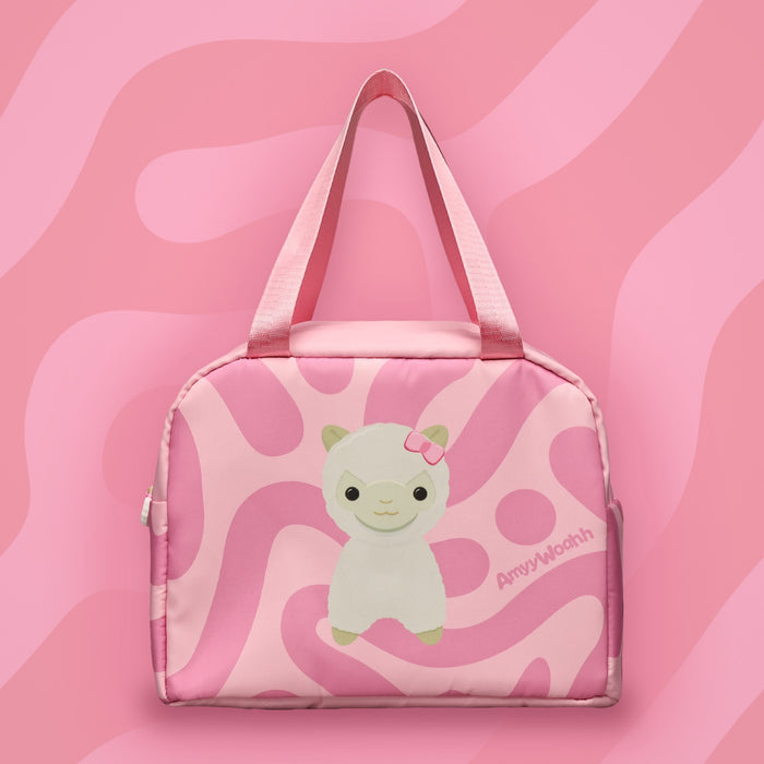 Fluffbean lunch box on a pink swirl background